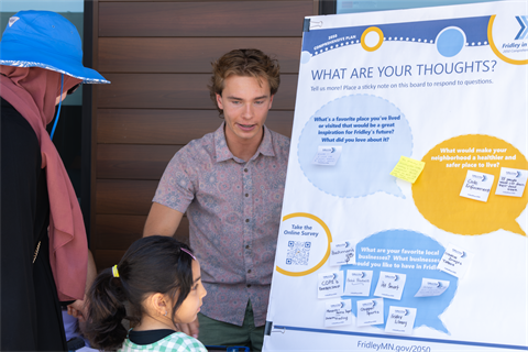 Community Development employee tabling at an event