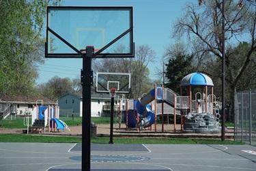 Two basketball hoop with a Timberwolves logo on the court