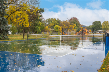 A tennis court in a park