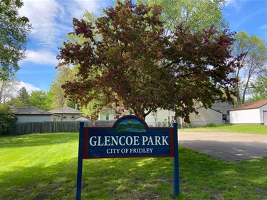 Park sign with basketball court