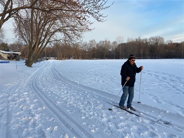 A person cross-country skiing in a park