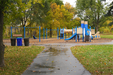 A playground set with slides and swings