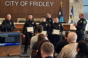 Three officers receiving awards at the 2024 Commendation Awards Ceremony