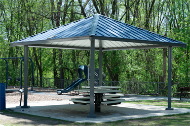 A picnic shelter with a table and benches