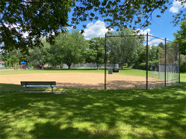 A ballfield surrounded by trees