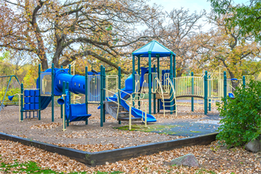 A playground set with multiple slides and tunnels
