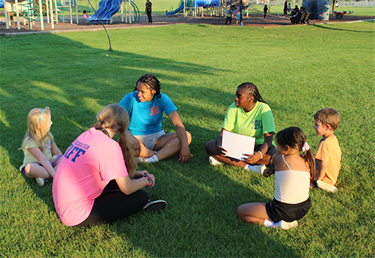 Recreation staff with kids at the park